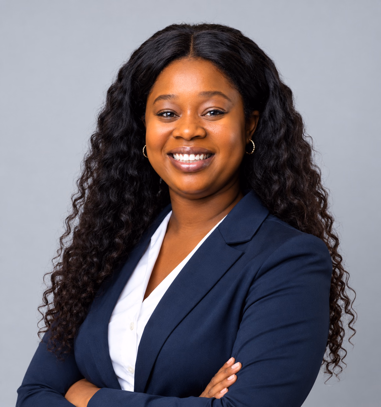 Wellspring Integrative Psychiatry provider smiling in a navy blazer and white blouse